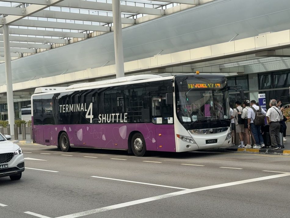 airport shuttle bus waiting outside a terminal