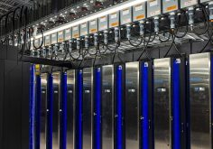 Rows of supercomputer cabinets in a high-performance computing hall