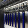Rows of supercomputer cabinets in a high-performance computing hall