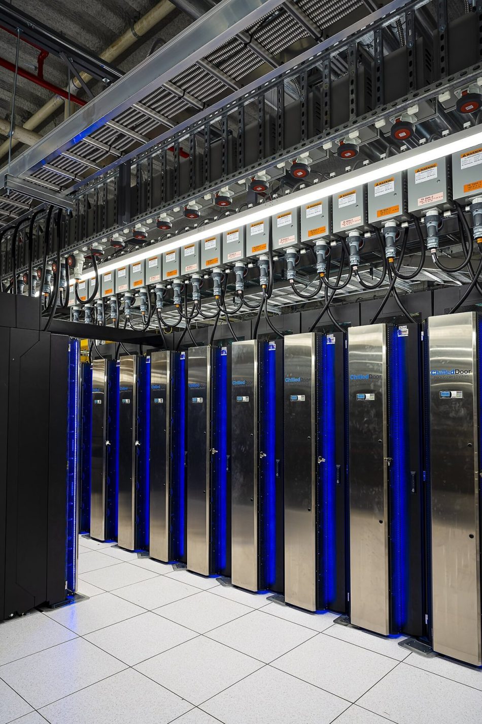 Rows of supercomputer cabinets in a high-performance computing hall