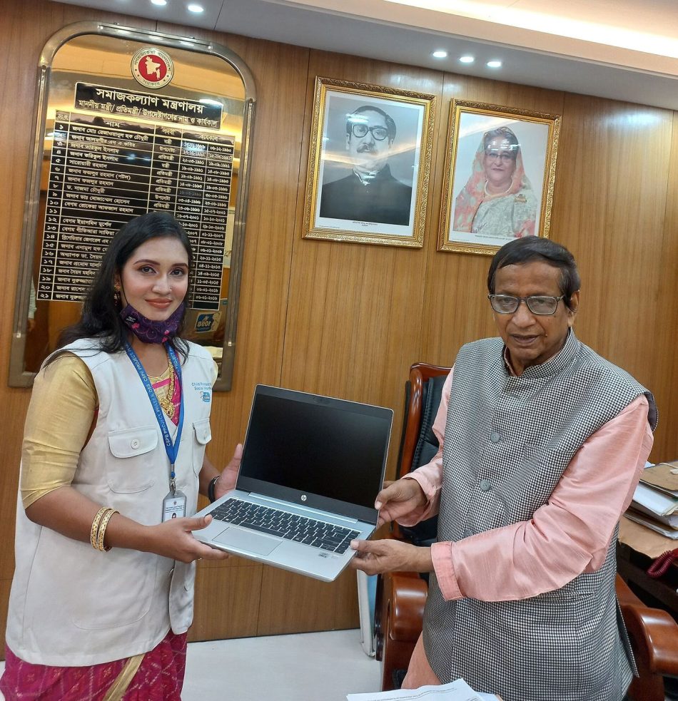 professionals working with AI tools on laptops in office