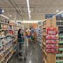 Shelves of packaged foods in a supermarket aisle.