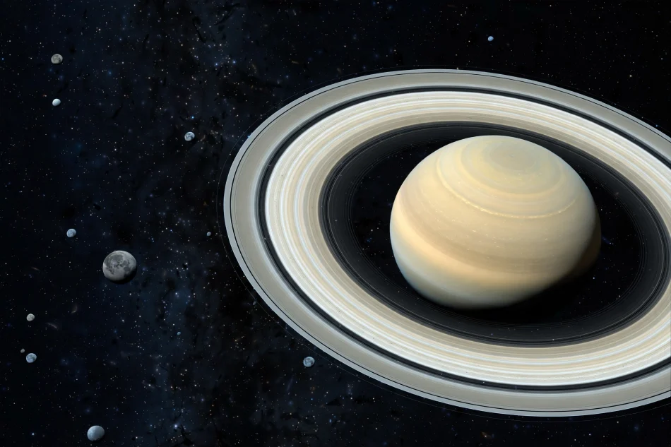 Saturn and its rings surrounded by many small moons in deep space